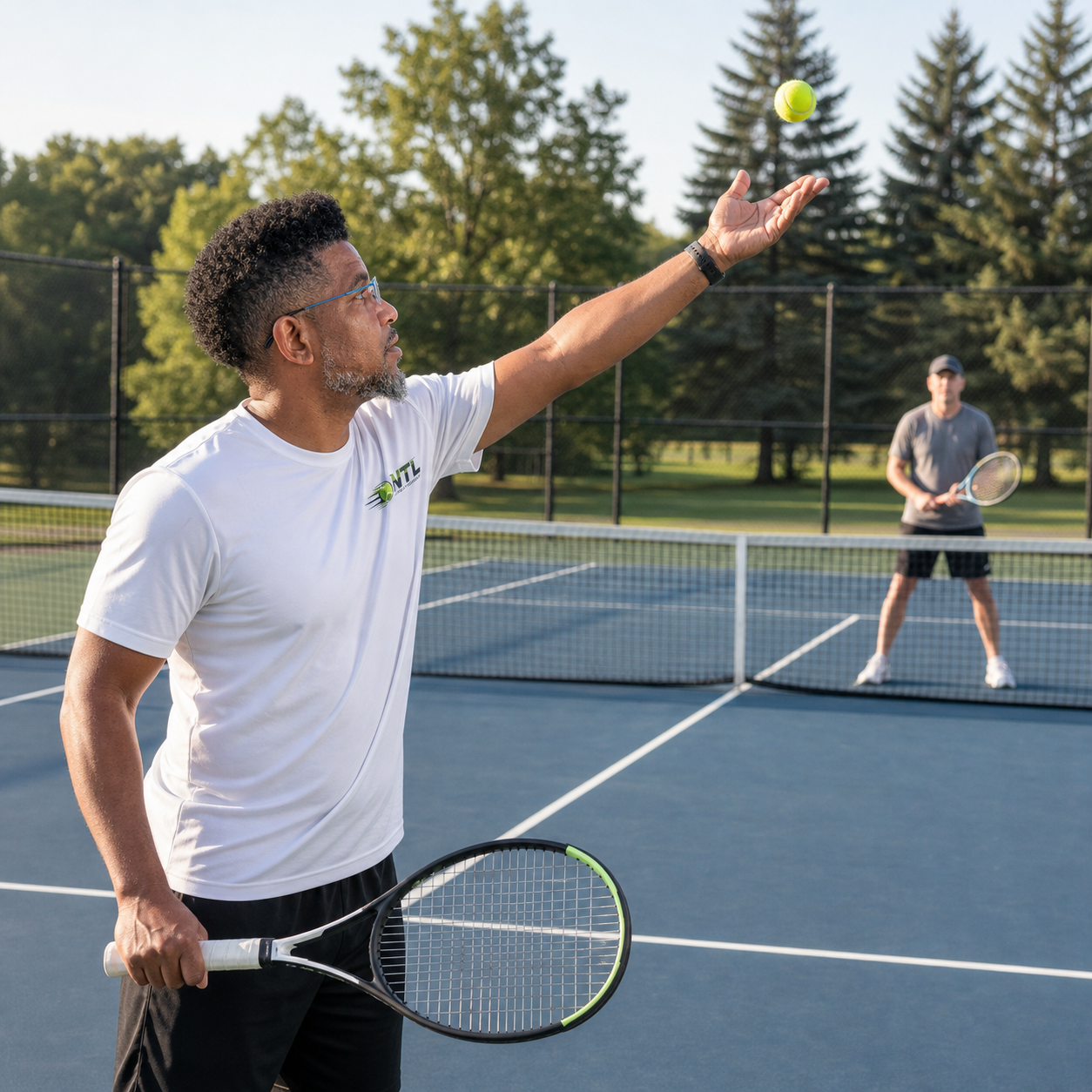 Daniel German coaching a tennis serve